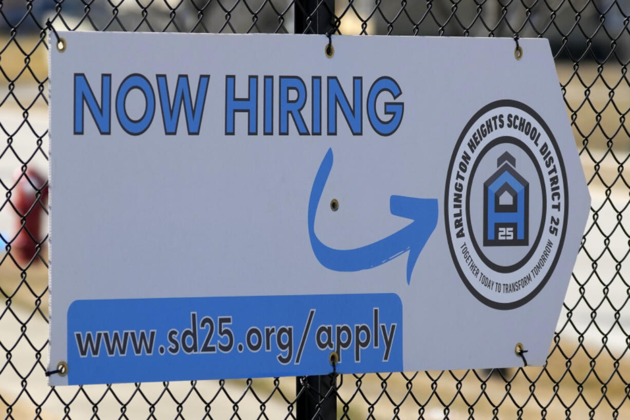 A hiring sign is displayed in Arlington Heights, Ill., Monday, Feb. 26, 2024. On Thursday, March 21, 2024, Freddie Mac reports on this week&rsquo;s average U.S. mortgage rates. (AP Photo/Nam Y.