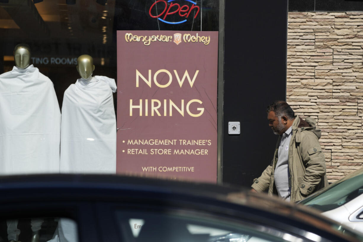 A hiring sign is displayed at a retail store in Chicago on Monday, March 11, 2024. On Thursday, March 14, 2024, the Labor Department reports on the number of people who applied for unemployment benefits last week. (AP Photo/Nam Y.