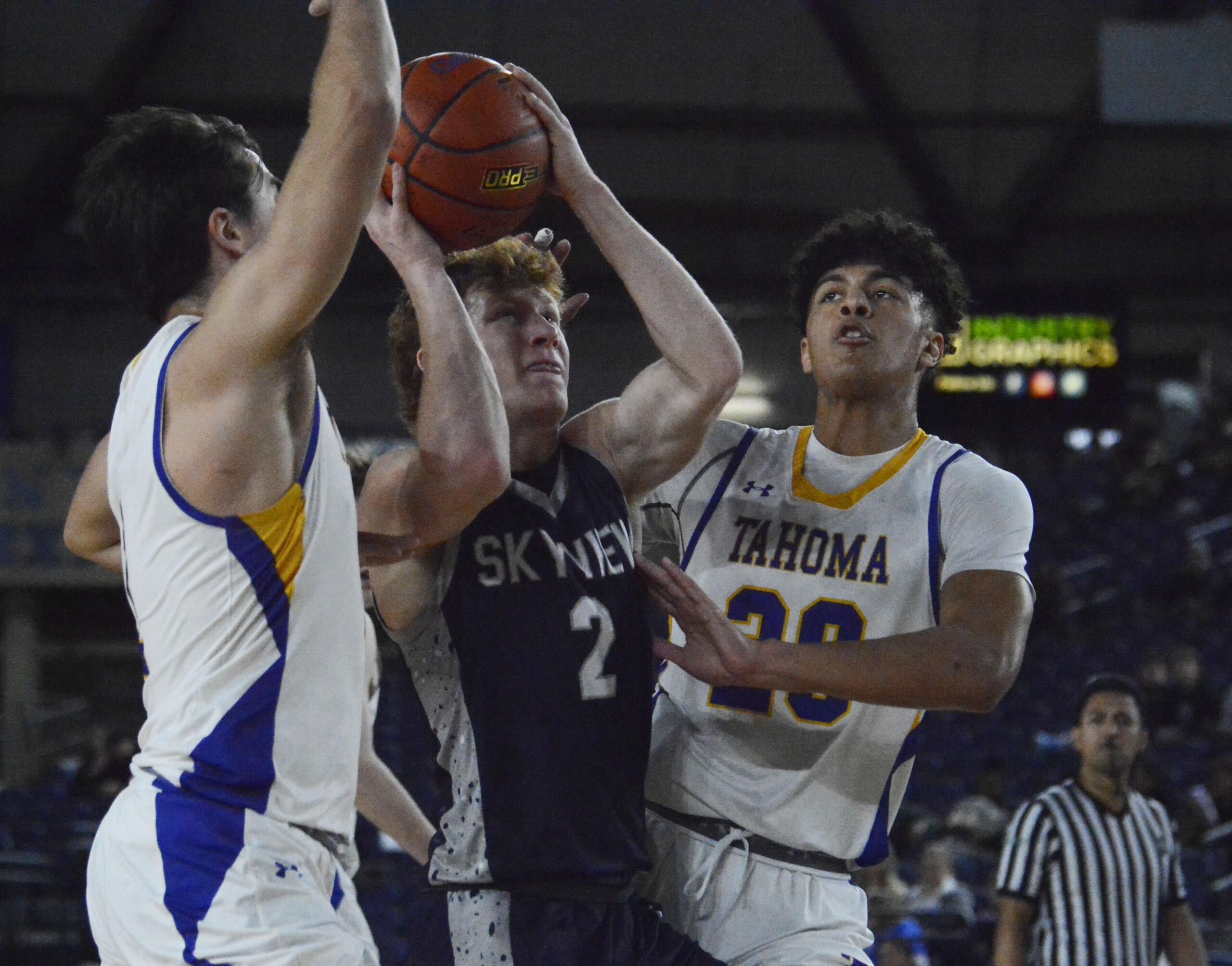 Gavin Packer (2) finds space in the lane amid Tahoma's defense during the first half of Skyview's consolation game against the Bears. Packer finished with six points, four rebounds and two assists.