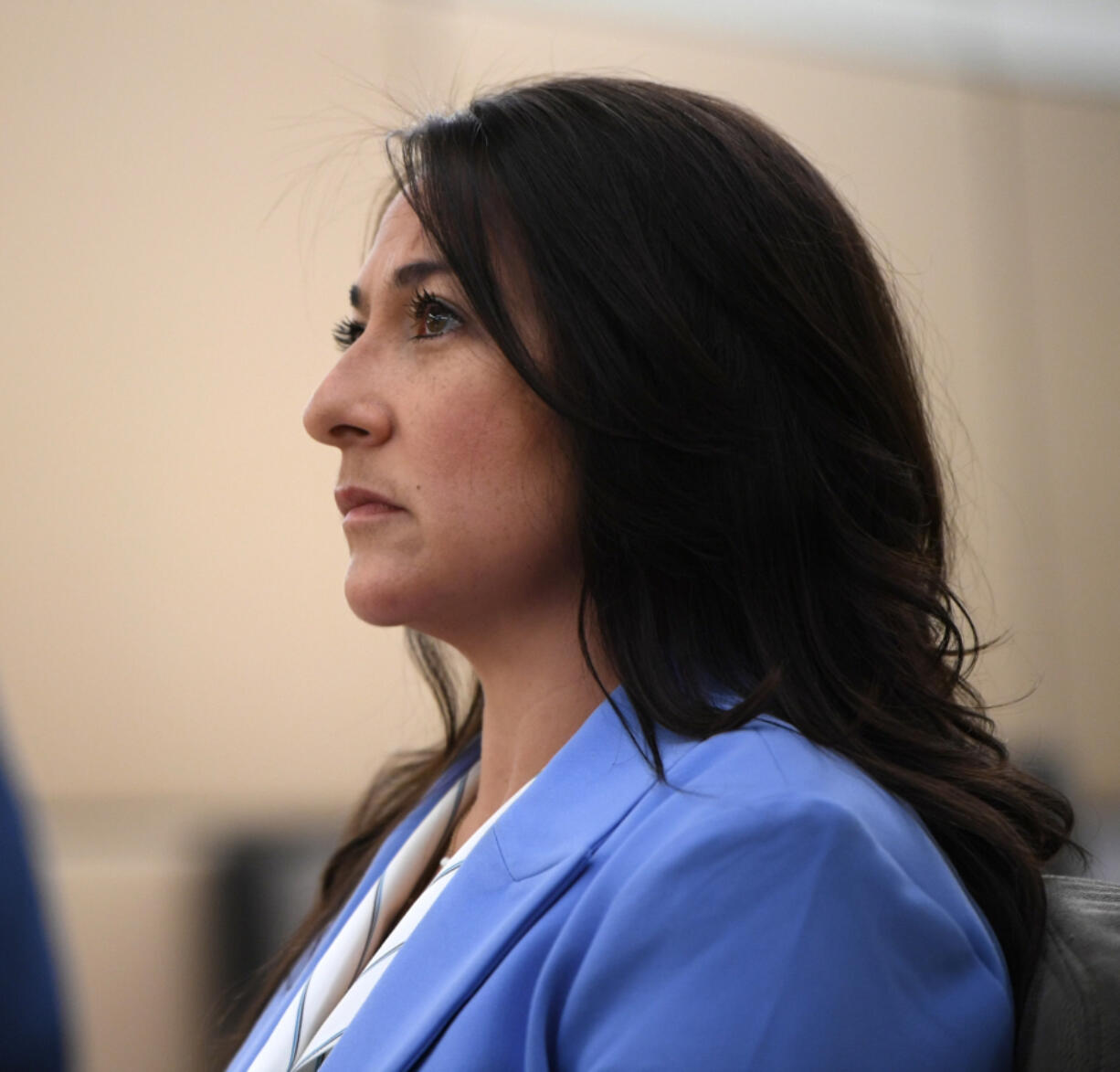 Vancouver police Officer Andrea Mendoza watches her body camera footage Monday during closing arguments in her misdemeanor assault trial in Clark County District Court. Mendoza faced the assault charge after threatening to use her Taser on the genitals of a suspected shoplifter in May.