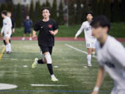 King&rsquo;s Way Christian junior Luke Gomes, left, cuts toward the ball during a boys soccer game against Seton Catholic on March 21 in Vancouver.
