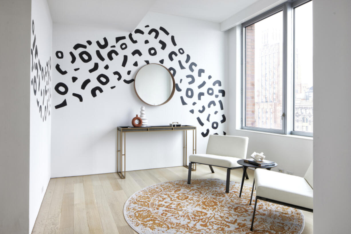 Wall stickers add a graphic element to this reading area.
