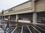A customer leaves the Safeway at 13719 S.E. Mill Plain Blvd. The building is now owned by a company controlled by a Las Vegas auto dealer, sparking rumors it may be repurposed.
