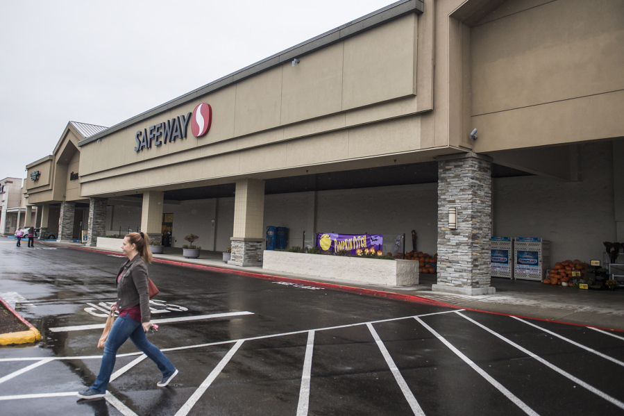 A customer leaves the Safeway at 13719 S.E. Mill Plain Blvd. The building is now owned by a company controlled by a Las Vegas auto dealer, sparking rumors it may be repurposed.