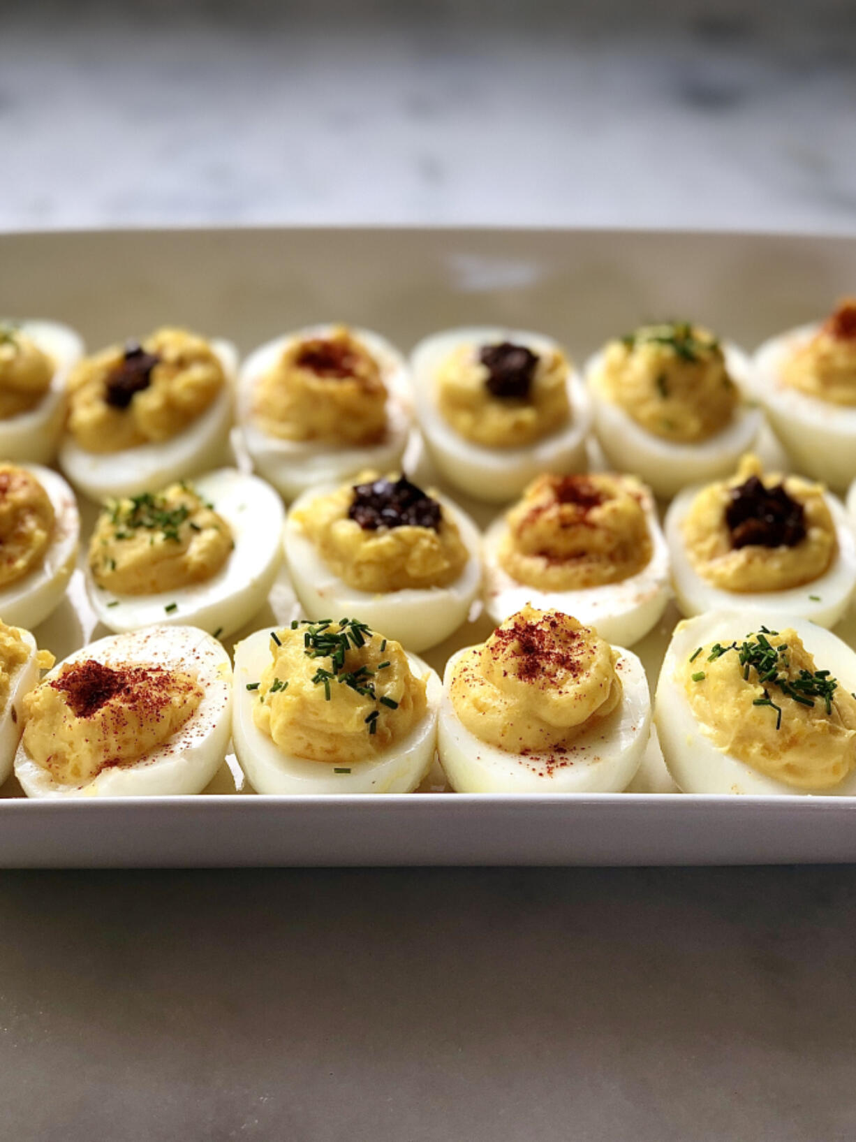 Deviled eggs just dusted with paprika are always a favorite.