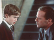 Haley Joel Osment, left, and Bruce Willis in &ldquo;The Sixth Sense.&rdquo; (Hulton Archive)