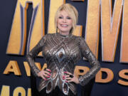 Singer and songwriter Dolly Parton arrives for the 57th Academy of Country Music awards on March 7, 2022, in Las Vegas.