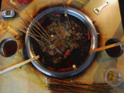 &ldquo;Malatang&rdquo; snack hot pot is seen on May 10, 2005, at a street booth in Chongqing Municipality, China.