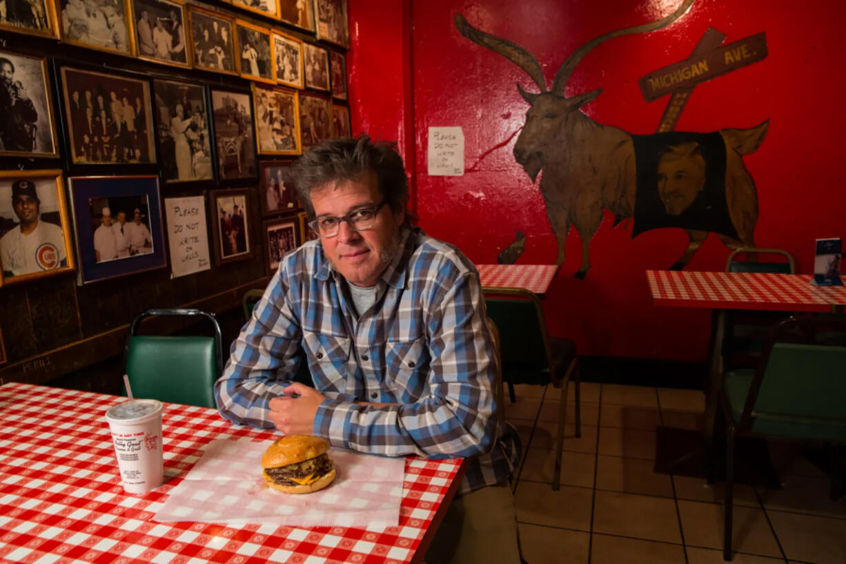 George Motz with a triple cheeseburger at the Billy Goat Tavern in Chicago, April 4, 2013, is America&rsquo;s leading hamburger expert.