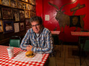 George Motz with a triple cheeseburger at the Billy Goat Tavern in Chicago, April 4, 2013, is America&rsquo;s leading hamburger expert.