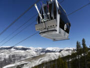 A gondola heads up the mountain at the Vail Resort on April 6, 2016, in Vail, Colorado.