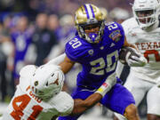 Washington running back Tylin &ldquo;Tybo&rdquo; Rogers (20) was arrested Friday, April 5, and charged Tuesday, April 9, with raping two women in Seattle. Court documents say he played in two College Football Playoff games for the school after the allegations were known to the university.