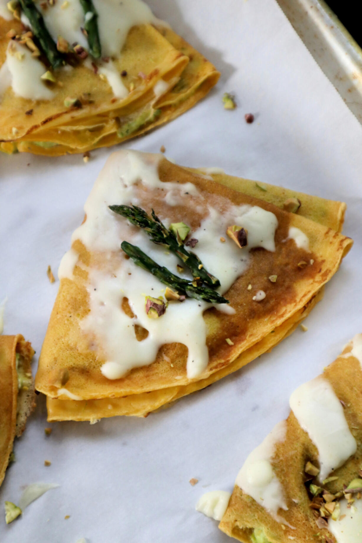 Pureed asparagus blended with fresh ricotta is a seasonal filling for these savory crepes.