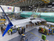 Boeing employees work on the 737 MAX on the final assembly line at Boeing&Ccedil;&fnof;&Ugrave;s Renton, Washington, plant on June 15, 2022. (Ellen M.