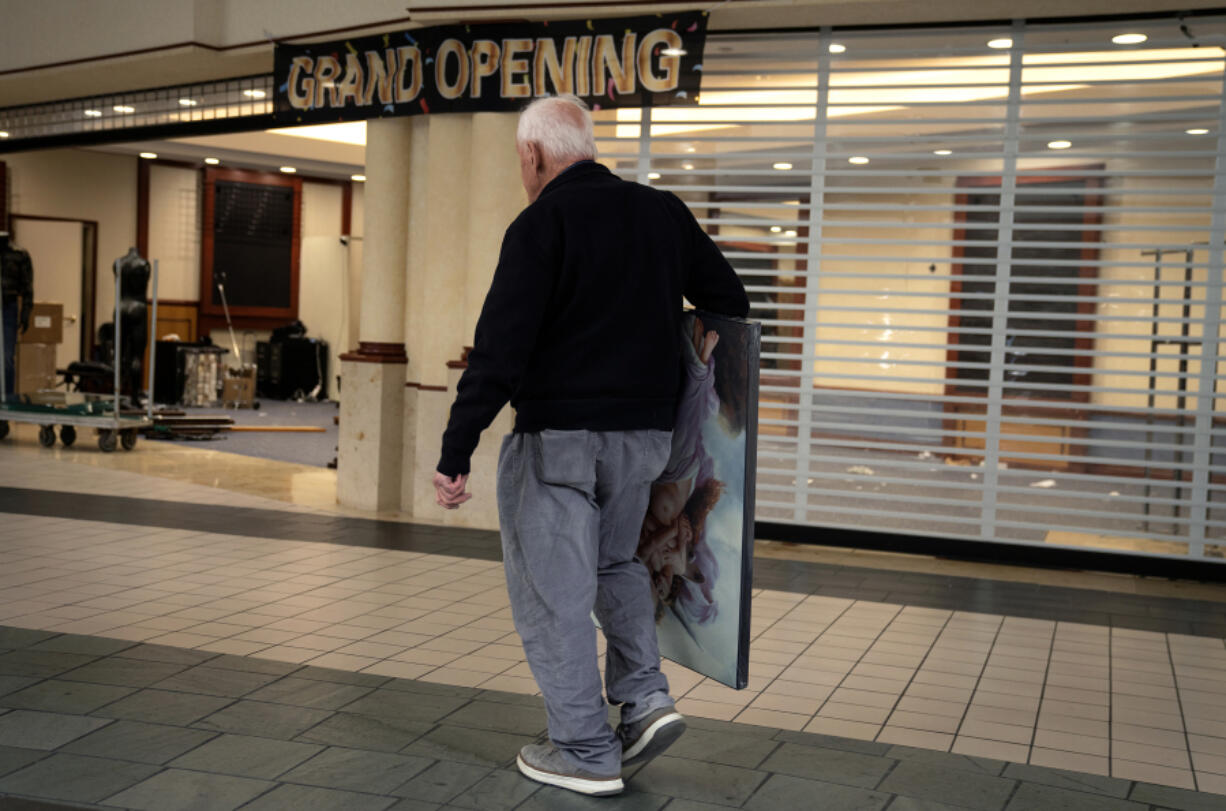 A shopper finds a last-minute bargain at the Spring Hill Mall in West Dundee, Illinois, which is closing after 43 years, on March 20, 2024. (E.