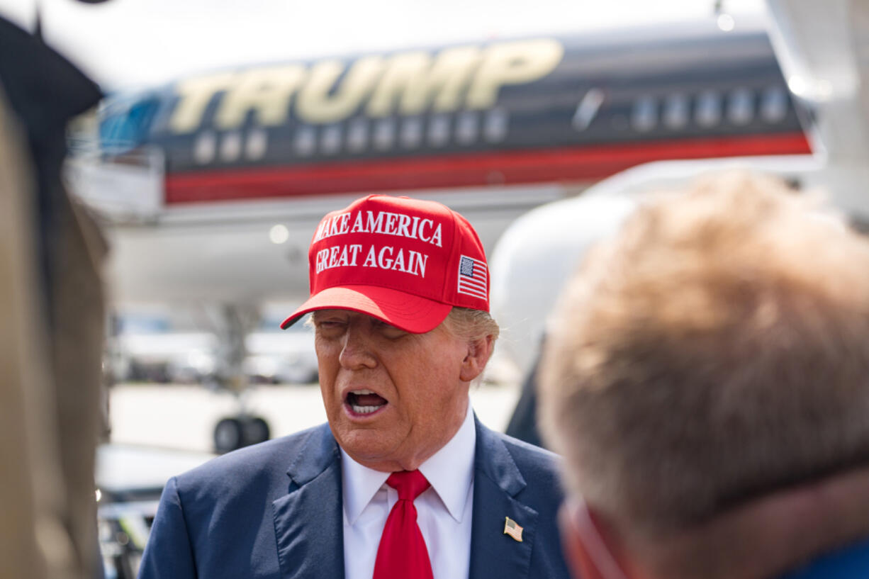 Former U.S. President Donald Trump speaks to the media as he arrives at the Atlanta Airport on April 10, 2024, in Atlanta, Georgia. Trump is visiting Atlanta for a campaign fundraising event he is hosting.