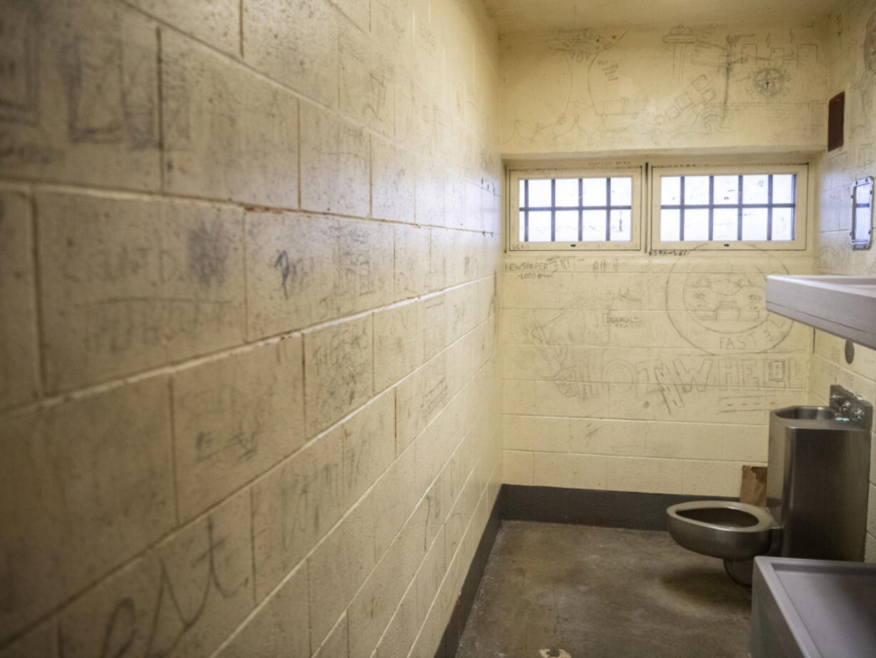 Graffiti covers the walls of a jail cell at the Clark County Jail.