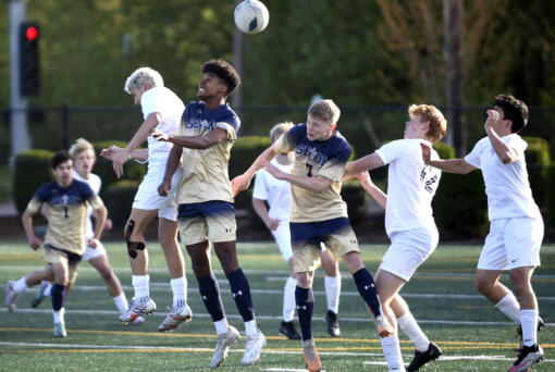 Seton Catholic's Derebe Smith (8) goes up for the ball against King's Way Christian's Leif Evenson, left, during a Trico League boys soccer match on Tuesday, April 16, 2024, at Seton Catholic High School.