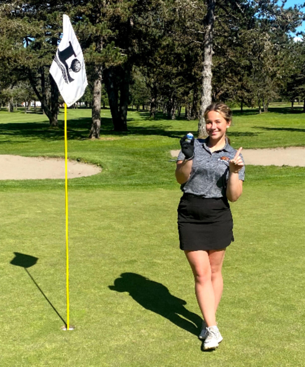 Woodland High senior Brooklyn Gaston made a hole-in-one at the No. 3 hole at Lewis River Golf Course on Wednesday in the non-league match against Battle Ground. Gaston shared medalist honors with a 42.