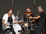 From left, Eddie Vedder, Matt Cameron and Stone Gossard of Pearl Jam perform onstage in Hyde Park on July 8, 2022, in London.