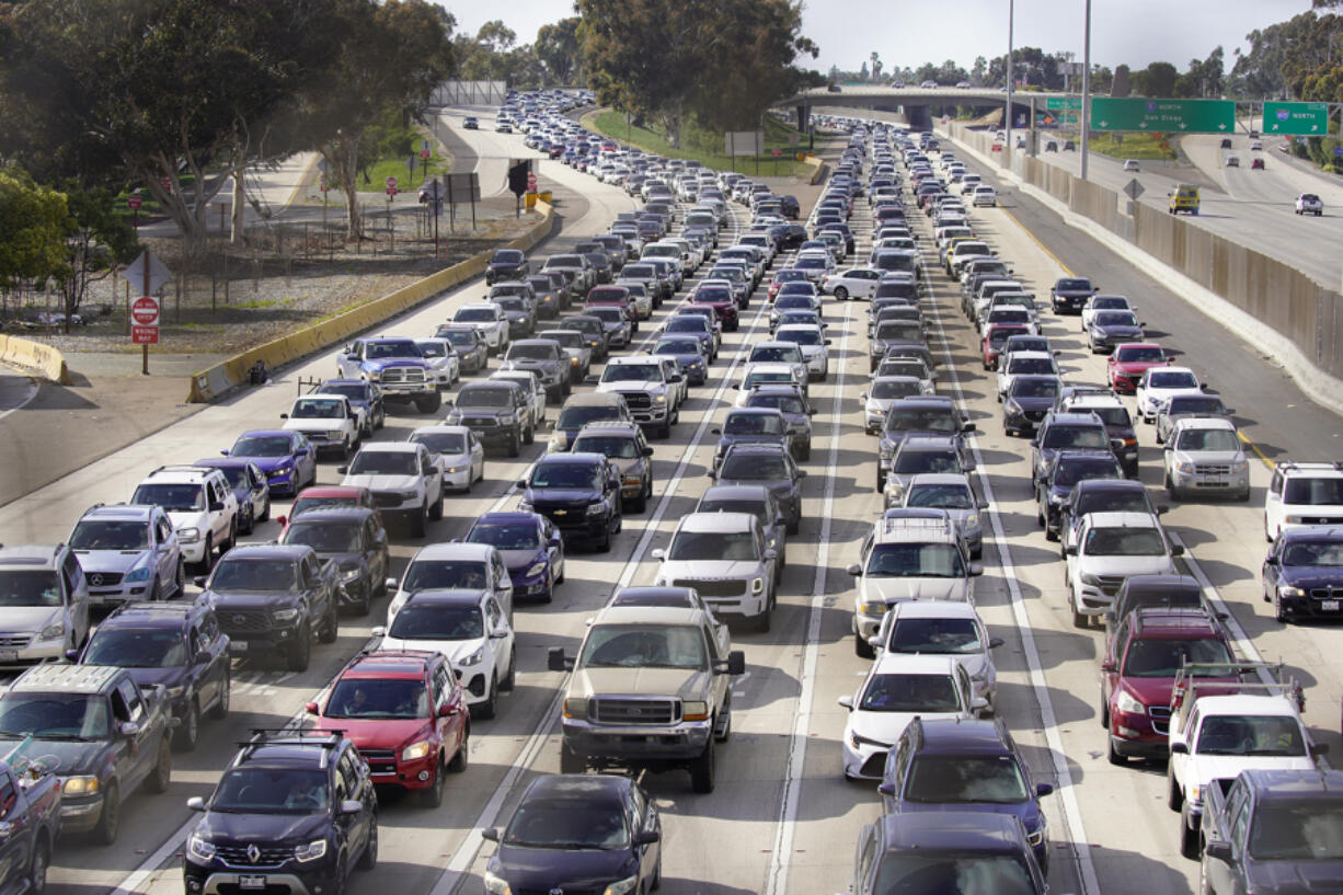 Bumper-to-bumper traffic builds on interstates 805 and 5 south as cars line up to wait over an hour to head into Mexico on March 26.