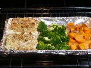 Pecan-crusted halibut, broccoli and sweet potato cubes come together quickly for a one-pan meal.