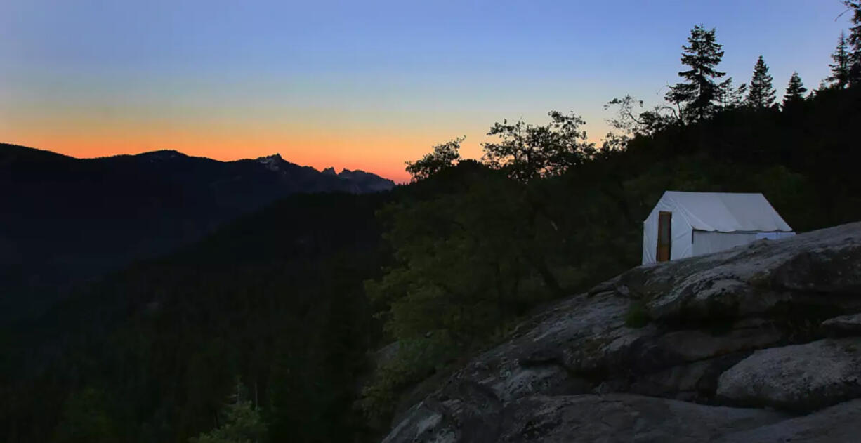 A tent is shown at dusk at a High Sierra Camp in Yosemite National Park. The park is reopening three of its five &ldquo;glamping&rdquo; campsites this summer.