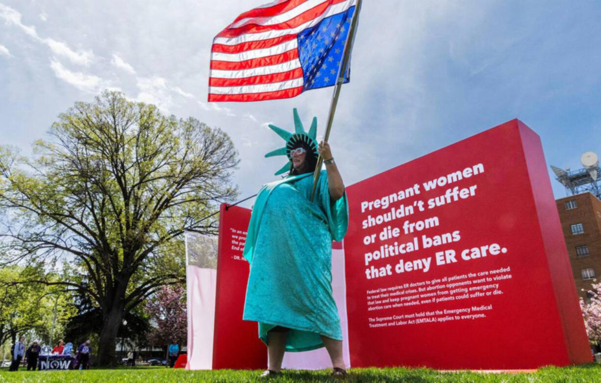 Jamie Richmond, Boise, dressed as a pregnant Statue of Liberty during a rally at the Idaho Capitol in Boise, Idaho, on Sunday, April 21, 2024. Hundreds gathered to support women and health care workers caught in the legal gray areas of Idaho&rsquo;s strict abortion legislation.