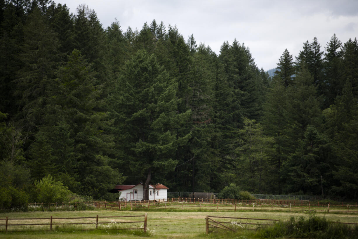 A home near the border of Camp Bonneville is visible from Northeast 68th Street in Vancouver on June 21, 2019.