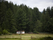A home near the border of Camp Bonneville is visible from Northeast 68th Street in Vancouver on June 21, 2019.