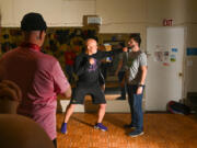 Instructor Mark Kernell, left, demonstrates how his fake punch never quite connects with assistant Tom Holtslander&rsquo;s face, during his introduction to &ldquo;safe&rdquo; pro-wrestling combat skills at Metropolitan Performing Arts in Vancouver.