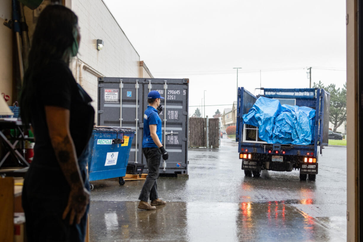 Sunny Rae Hanna, operations manager for the RePurpose Center, helps to position a truck full of furniture ready to be dropped off at the NW Furniture Bank on Mill Plain Boulevard in east Vancouver on March 27.