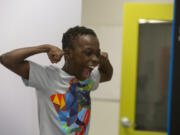 Hazel Dell Elementary School fourth-grader DJ Sanders, 10, strikes a strong pose in an AI photo booth at the Boys &amp; Girls Clubs of Southwest Washington&rsquo;s Clinton &amp; Gloria John Clubhouse on Thursday.