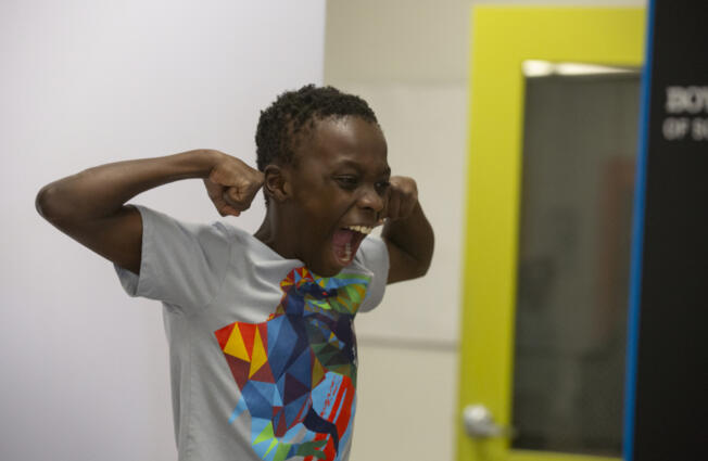 Hazel Dell Elementary School fourth-grader DJ Sanders, 10, strikes a strong pose in an AI photo booth at the Boys &amp; Girls Clubs of Southwest Washington&rsquo;s Clinton &amp; Gloria John Clubhouse on Thursday.