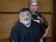 Former Camas High School girls head wrestling coach Mark Yamashita appears Tuesday at the Clark County Courthouse for sentencing in his child molestation case. Yamashita was sentenced to 20 months in prison.