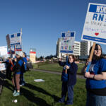 PeaceHealth Southwest Medical Center registered nurse Sarah Collins, right, joins colleagues as they picket outside the hospital on Thursday morning, April 18, 2024. (Amanda Cowan/The Columbian)