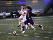Columbia River junior Fidel Banuelos breaks away toward scoring a goal against R.A. Long during the Rapids' 4-0 win over R.A. Long in a 2A Greater St. Helens League boys soccer match at Columbia River High School on Tuesday, April 9, 2024.
