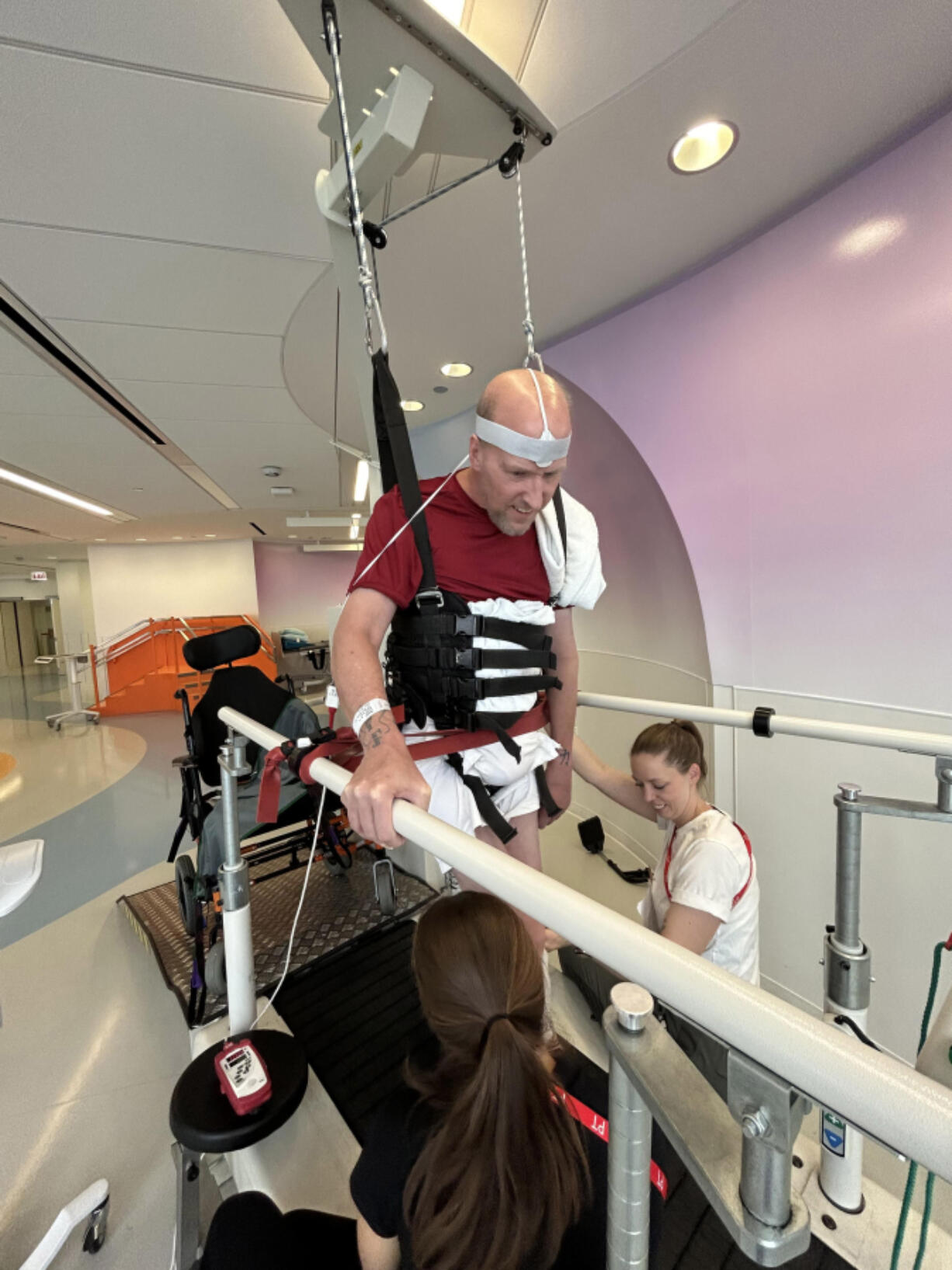 Scott Munro, a longtime educator and administrator in Evergreen Public Schools, works through physical rehabilitation exercises at a treatment center in Chicago. Munro suffered a hypoxic brain injury during an elective orthopedic surgery last fall.