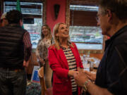 Republican 3rd Congressional District candidate Leslie Lewallen talks with Elden Ferris of Vancouver at a Monday meeting of the Southwest Washington Federated Republican Women.