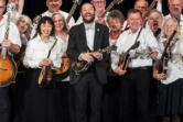 The lively Oregon Mandolin Orchestra, led by Christian McKee (center), features many Clark County players, including Andy Blitzer of Ridgefield (right of McKee).