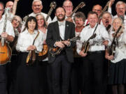 The lively Oregon Mandolin Orchestra, led by Christian McKee (center), features many Clark County players, including Andy Blitzer of Ridgefield (right of McKee).