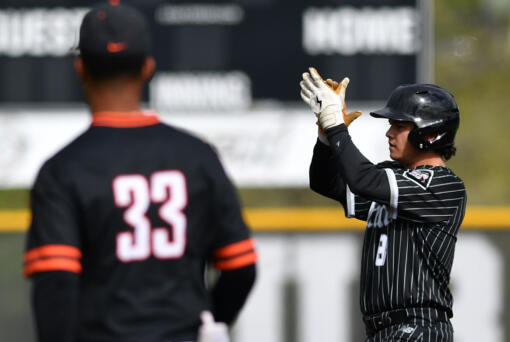 Union senior Ty Sutton (8) celebrates after hitting a double Friday, April 26, 2024, during Union’s 6-3 win against Battle Ground at Union High School. (Taylor Balkom/The Columbian)