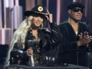 Beyonce, left, accepts the Innovator Award on Monday as presenter Stevie Wonder applauds during the iHeartRadio Music Awards at the Dolby Theatre in Los Angeles.