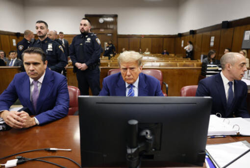 Former President Donald Trump awaits the start of proceedings on the second day of jury selection at Manhattan criminal court, Tuesday, April 16, 2024, in New York.  Trump returned to the courtroom Tuesday as a judge works to find a panel of jurors who will decide whether the former president is guilty of criminal charges alleging he falsified business records to cover up a sex scandal during the 2016 campaign.  (Michael M.