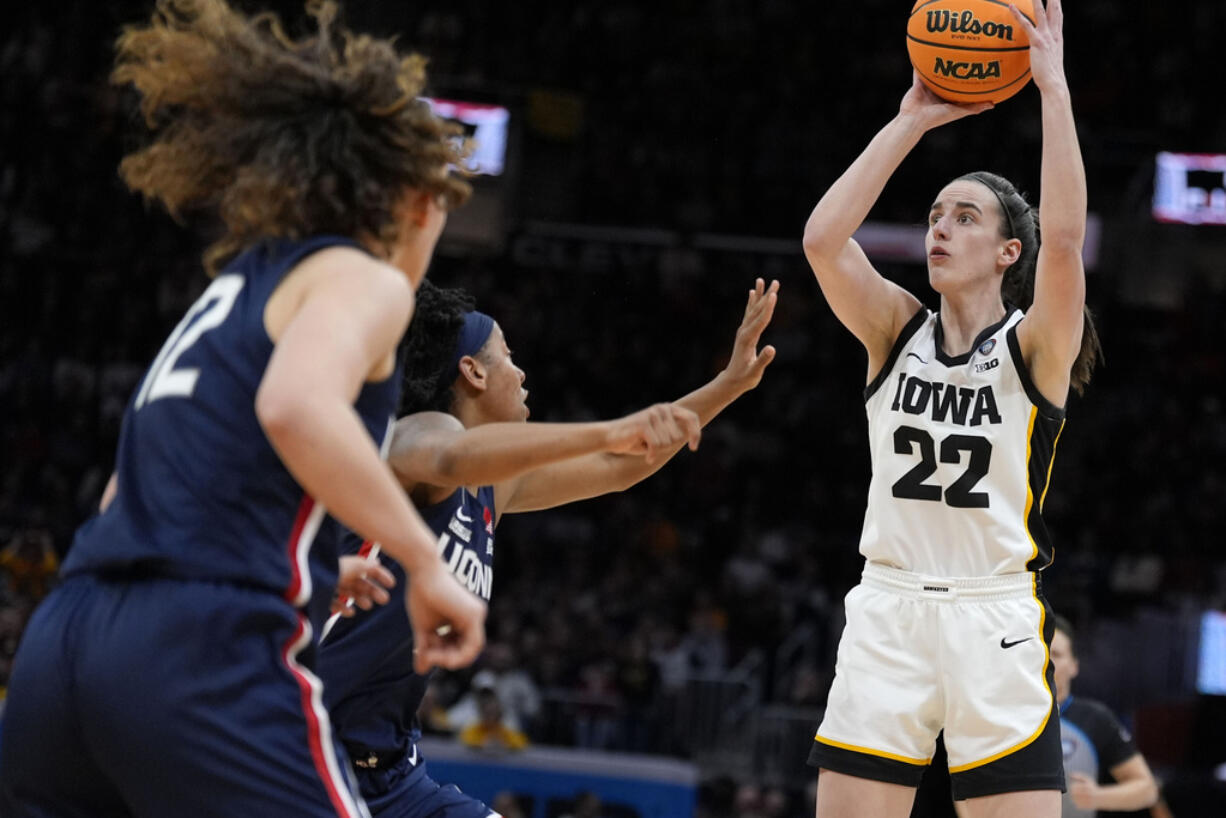 Iowa guard Caitlin Clark (22) shoots during the second half of a Final Four college basketball game against UConn in the women's NCAA Tournament, Friday, April 5, 2024, in Cleveland.