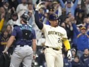 Milwaukee Brewers' William Contreras (24) celebrates a after walkoff walk during the ninth inning of a baseball game against the Seattle Mariners Friday, April 5, 2024, in Milwaukee.