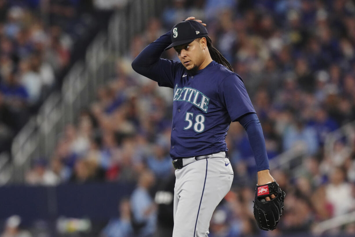 Seattle Mariners pitcher Luis Castillo reacts during fourth-inning baseball game action against the Toronto Blue Jays in Toronto, Monday, April 8, 2024.