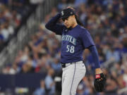 Seattle Mariners pitcher Luis Castillo reacts during fourth-inning baseball game action against the Toronto Blue Jays in Toronto, Monday, April 8, 2024.