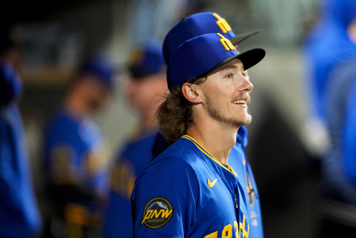 Seattle Mariners starting pitcher Bryce Miller stands in the dugout after being relieved during the seventh inning of a baseball game against the Chicago Cubs, Friday, April 12, 2024, in Seattle.