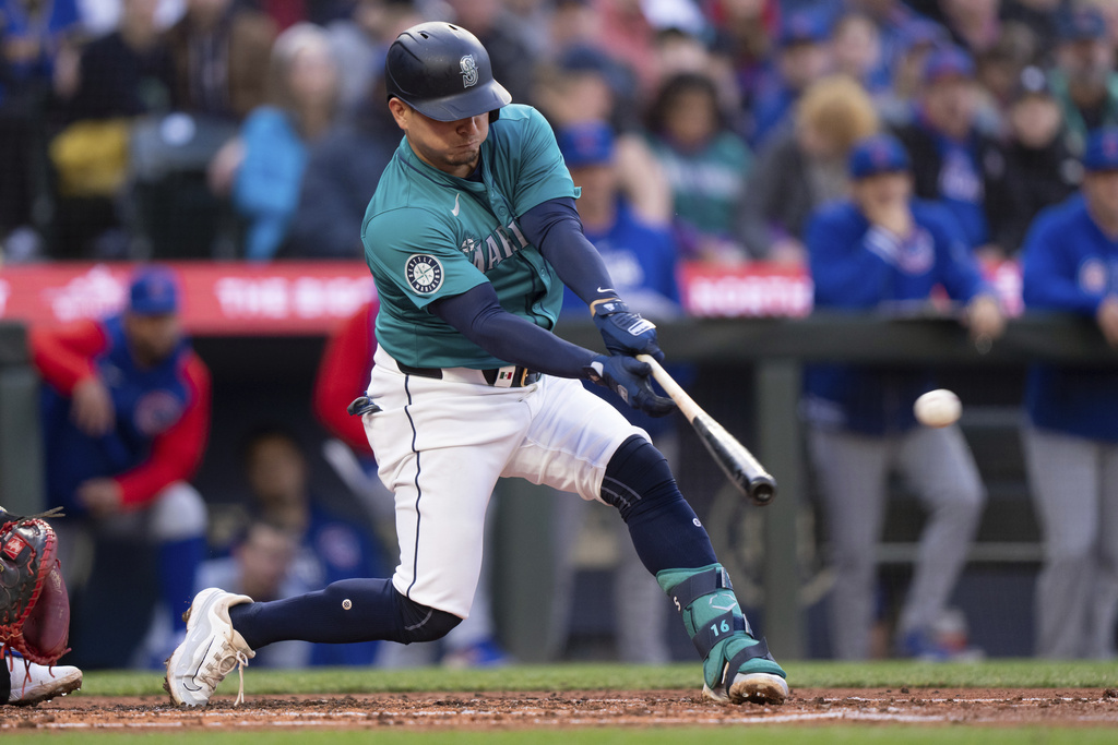 Seattle Mariners' Luis Urias hits an RBI double off Chicago Cubs starting pitcher Shota Imanaga during the second inning of a baseball game, Saturday, April 13, 2024, in Seattle.